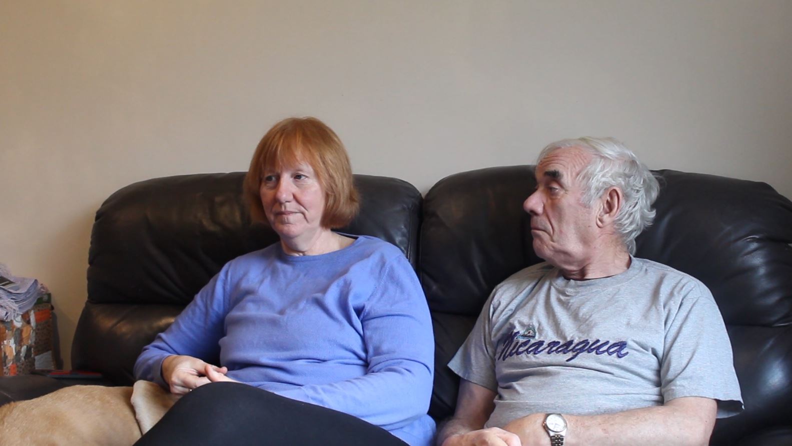 Liz and Mike Brookes sat side by side, at home in Rochdale.