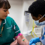 Michelle Hepburn, Clinical Research Practitioner at MFT, provides a blood sample as part of the PHE ESCAPE-COVID research study at MFT