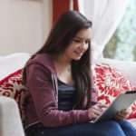 Teen girl using tablet