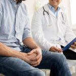 Male patient with a male doctor.