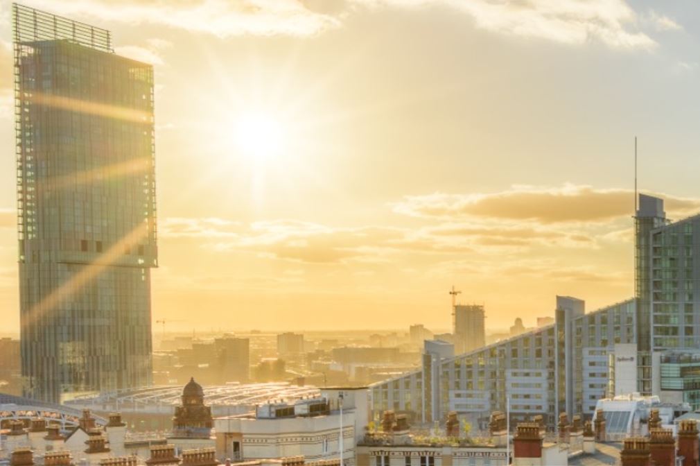 sun rises over Manchester city